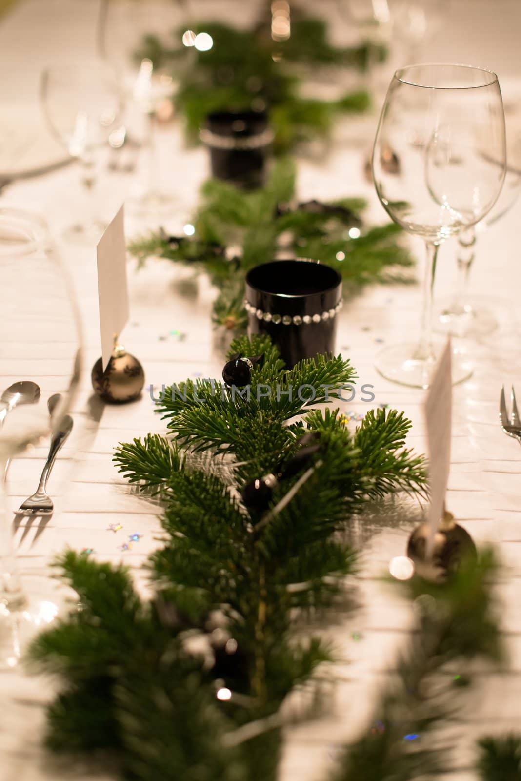 Festive XMas Table - Beautiful white, green and silver place setting for Christmas in emotional light