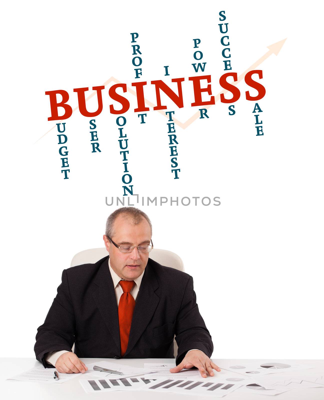 businessman sitting at desk with word cloud by ra2studio