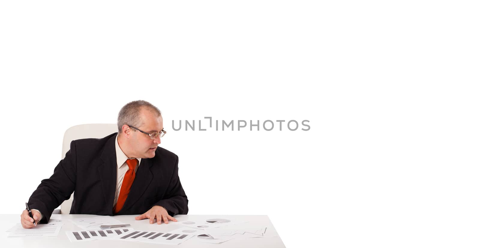 businessman sitting at desk with copy space by ra2studio