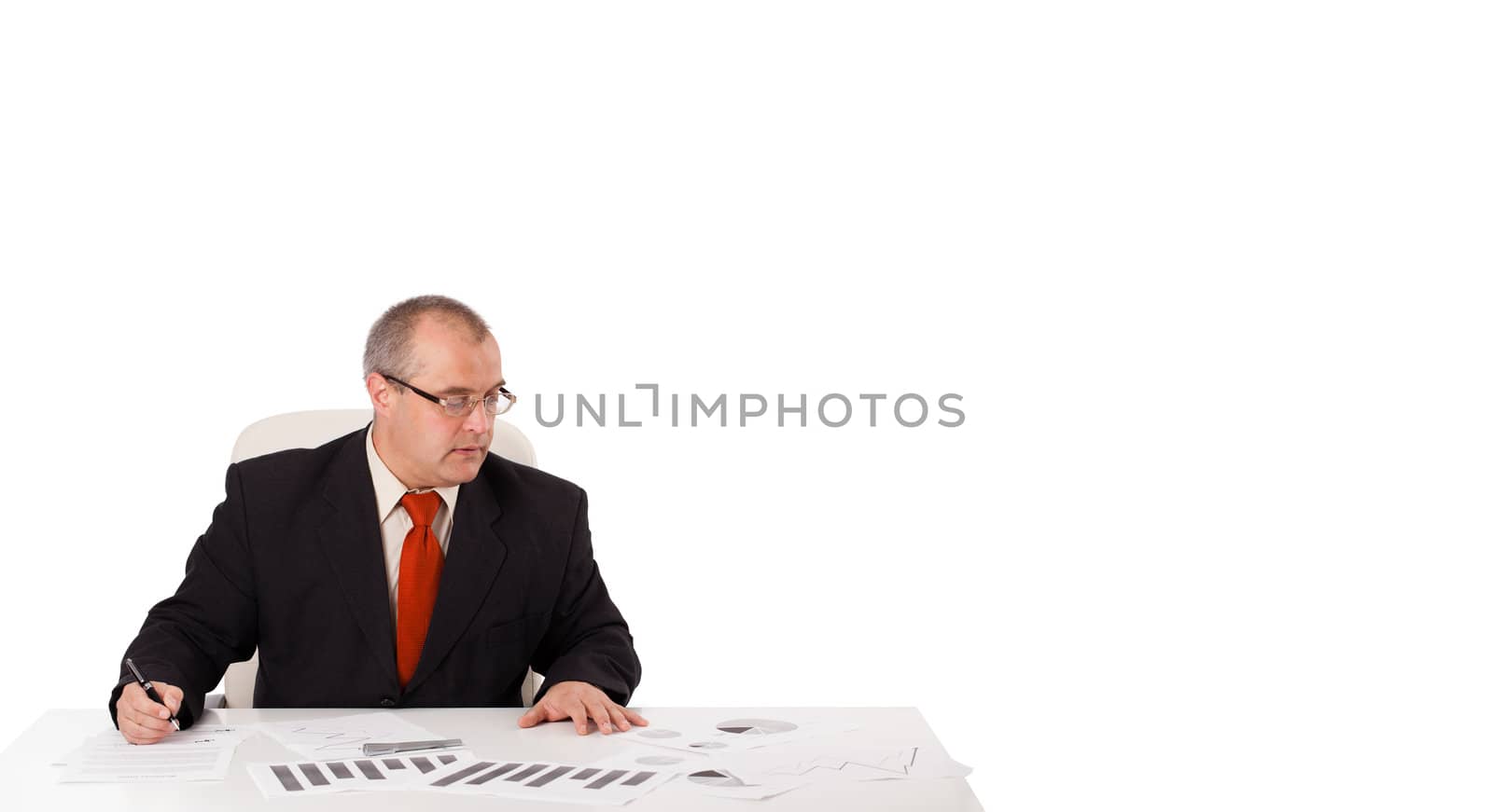 businessman sitting at desk with copy space, isolated on white