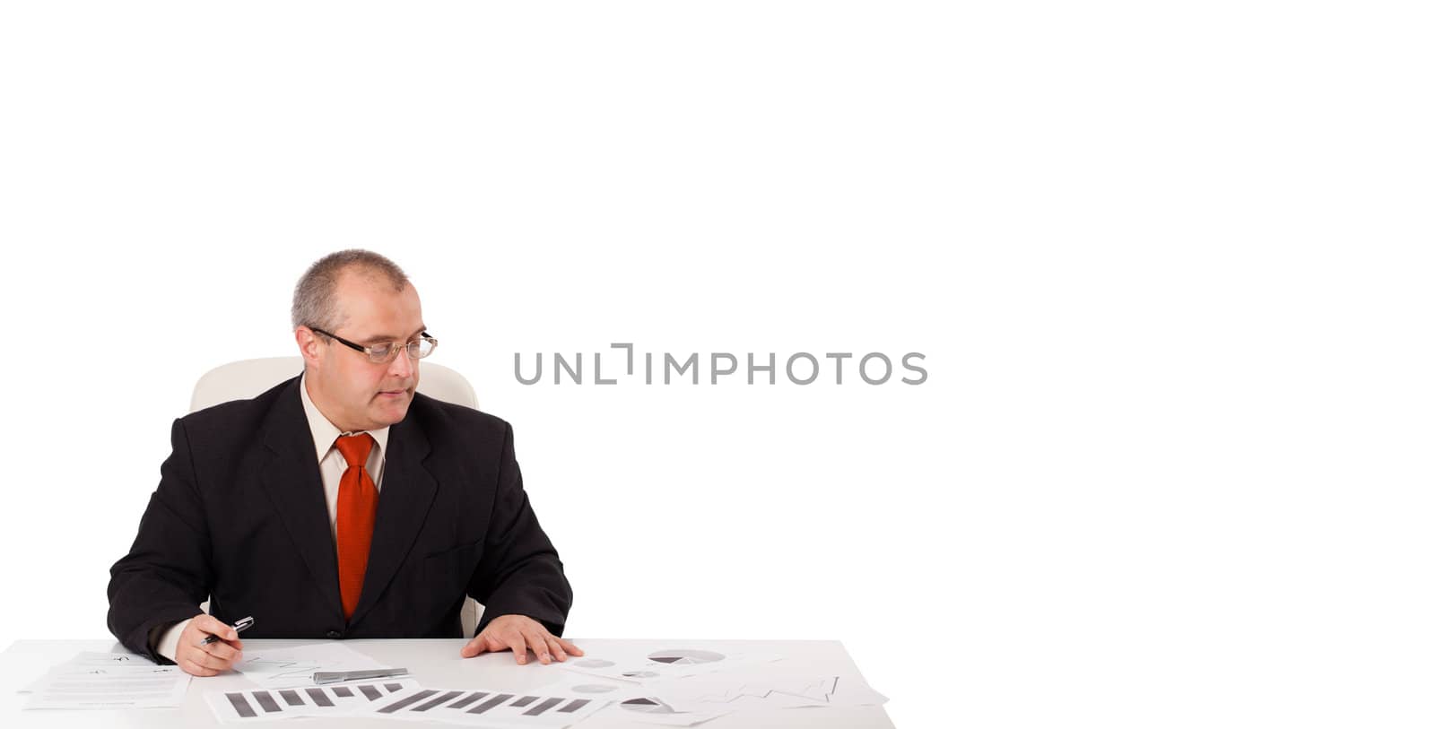 businessman sitting at desk with copy space, isolated on white