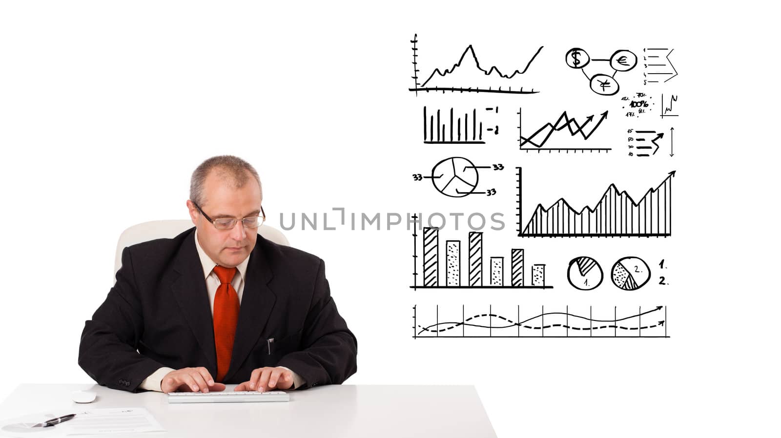 businessman sitting at desk with statistics and graphs, isolated on white