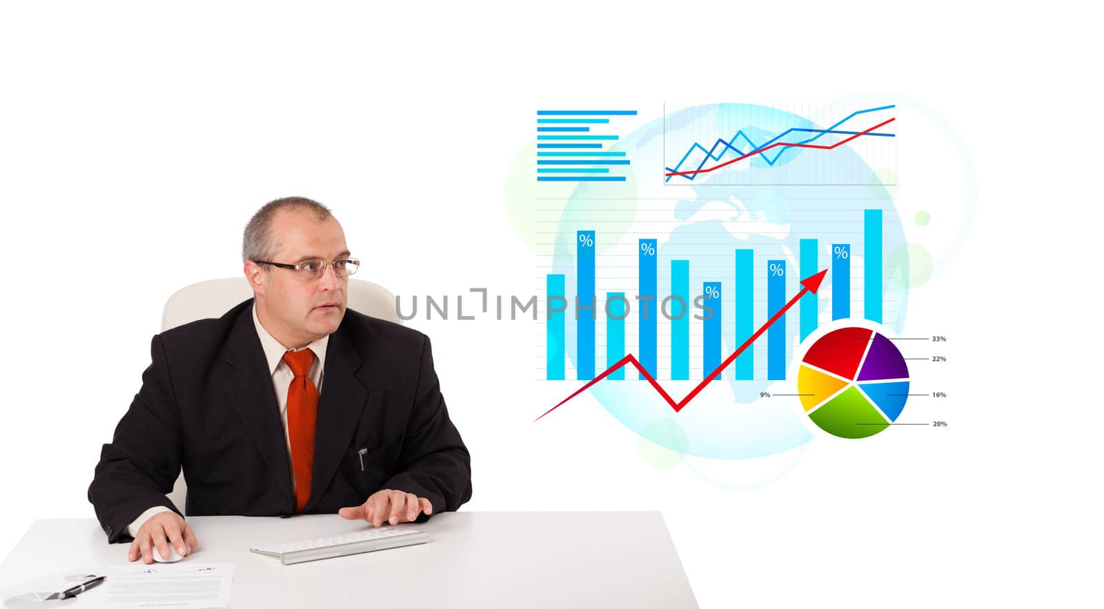 Businessman sitting at desk with statistics, isolated on white