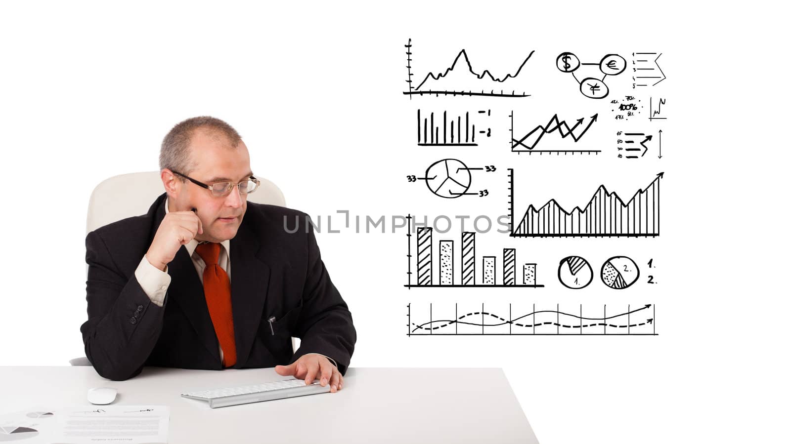 businessman sitting at desk with statistics and graphs, isolated on white