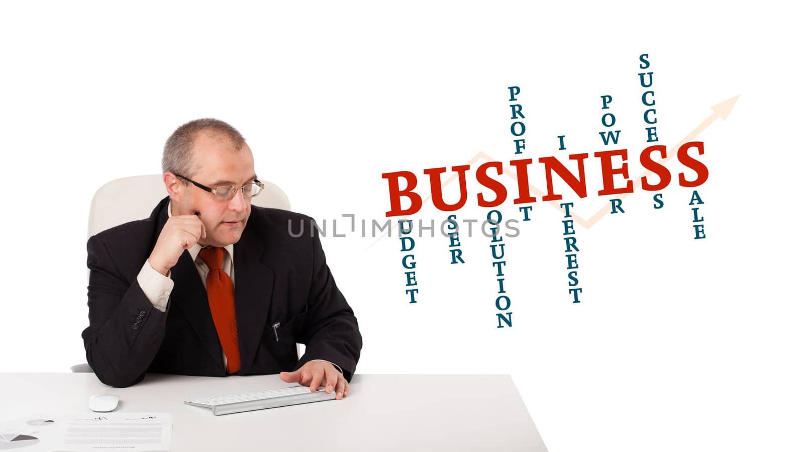 businessman sitting at desk and typing on keyboard with word cloud, isolated on white