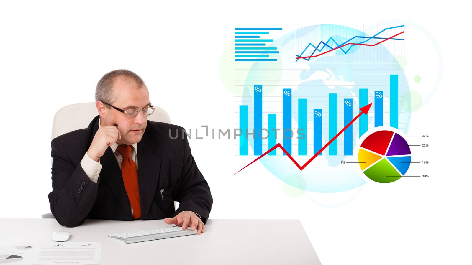 Businessman sitting at desk with statistics, isolated on white