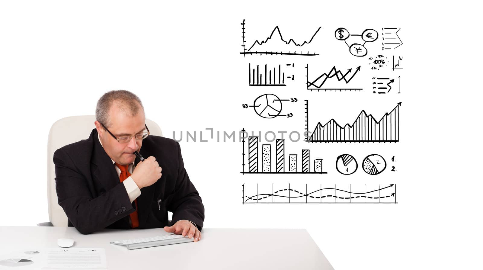 businessman sitting at desk with statistics and graphs, isolated on white