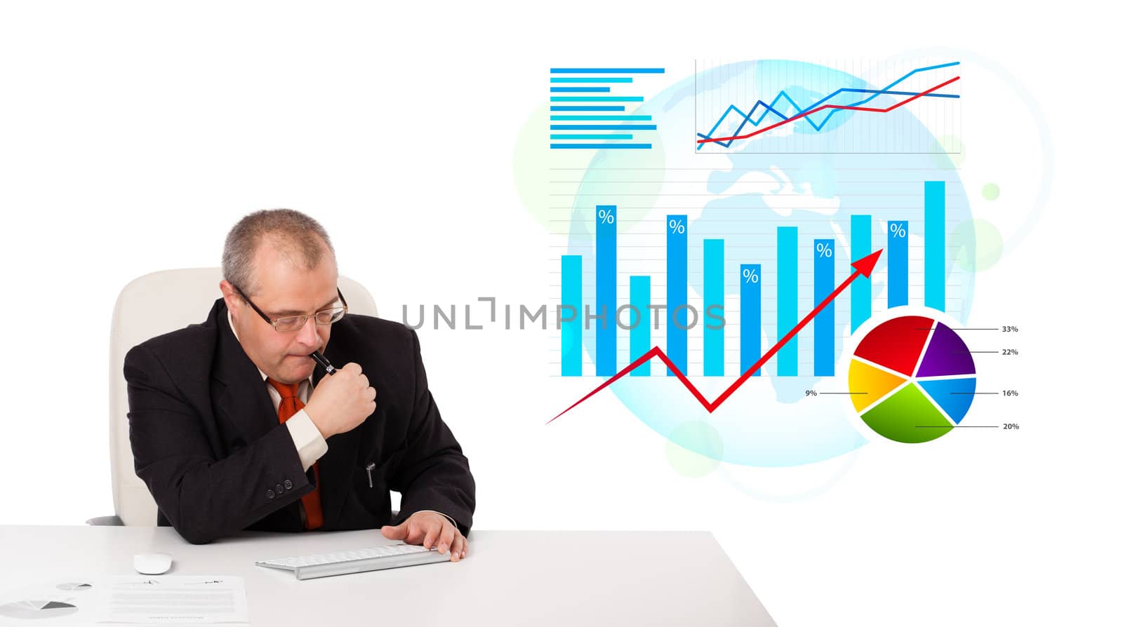 Businessman sitting at desk with statistics, isolated on white