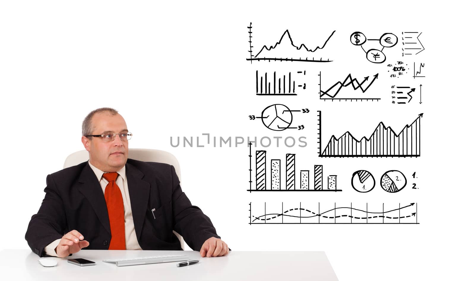 Businessman sitting at desk with diagrams and graphs, isolated on white