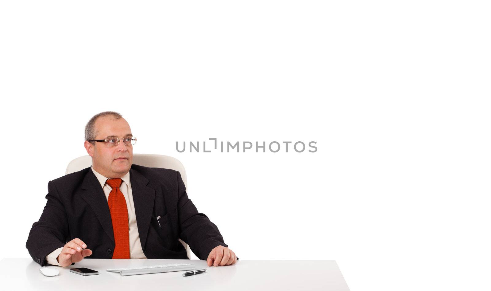 businessman sitting at desk with copy space, isolated on white