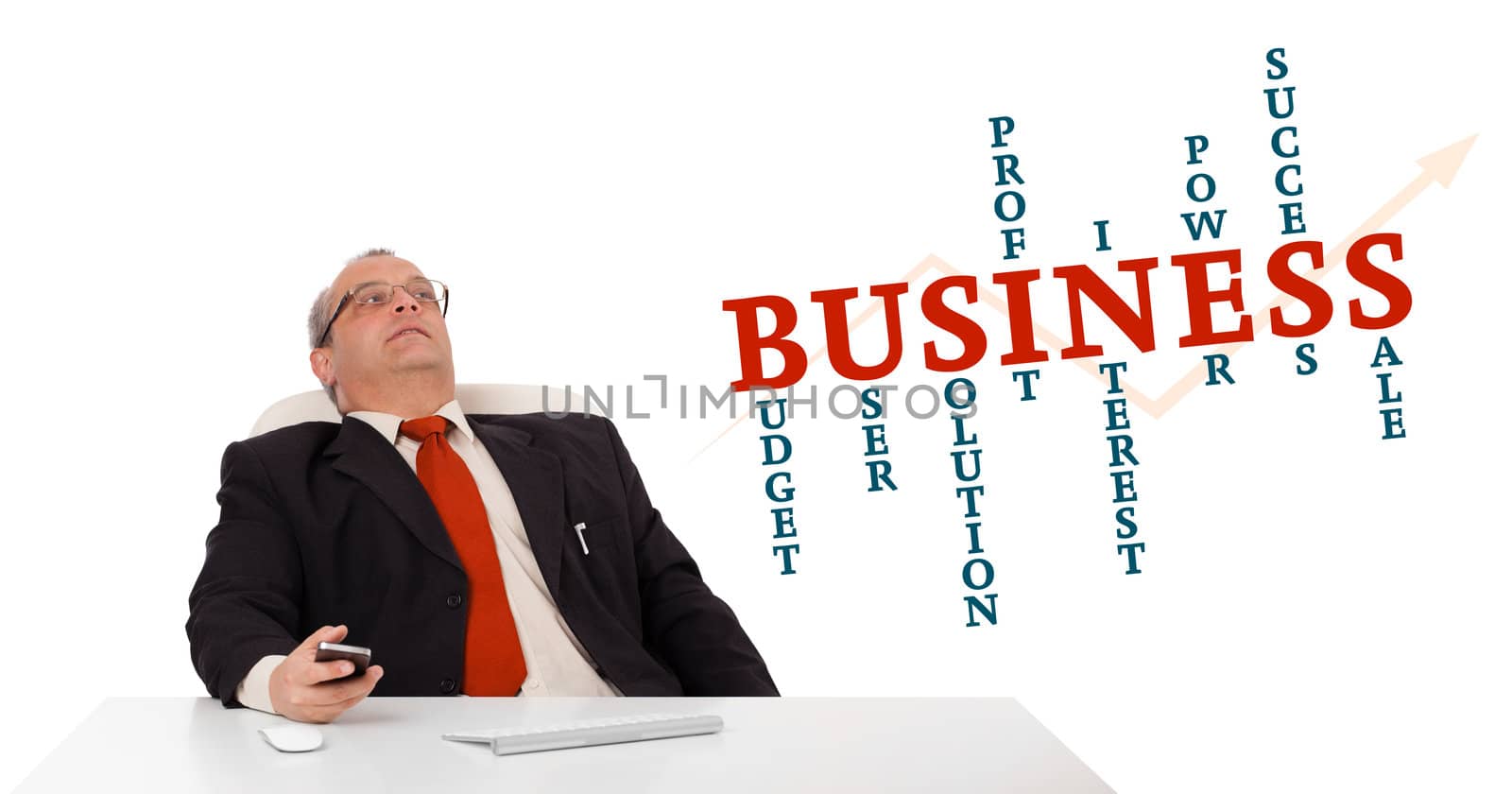 businessman sitting at desk and holding a mobilephone with business word cloud, isolated on white