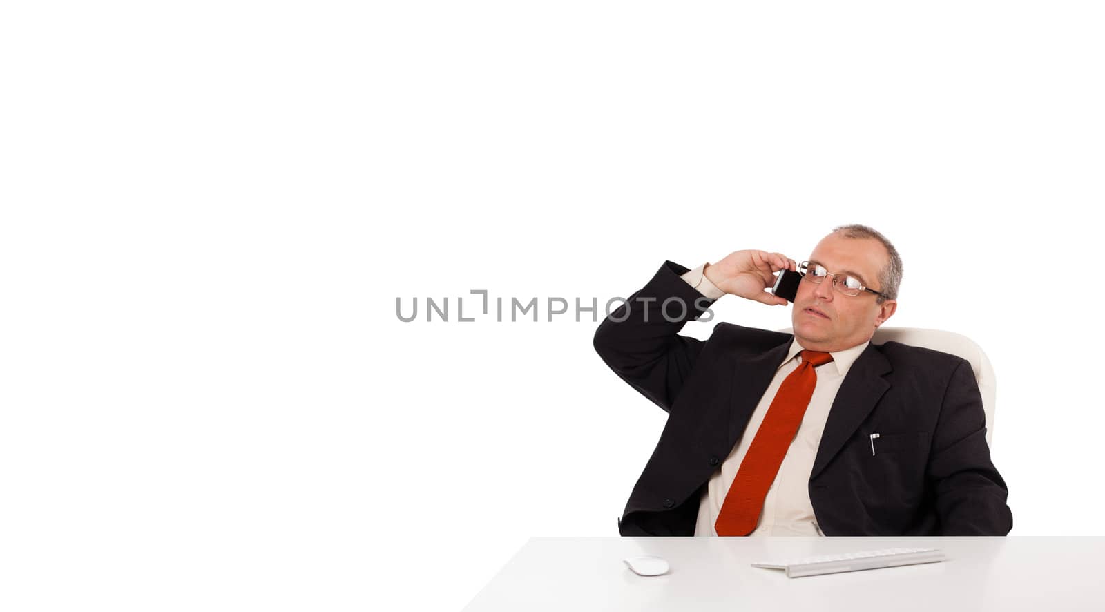 businessman sitting at desk and making phone call with copy space, isolated on white