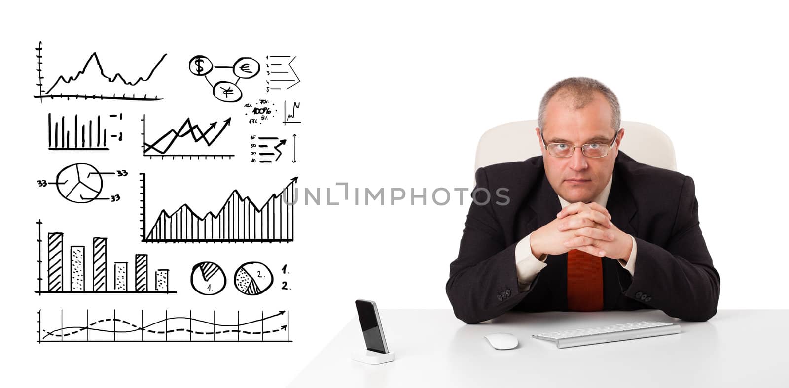 Businessman sitting at desk with diagrams and graphs, isolated on white