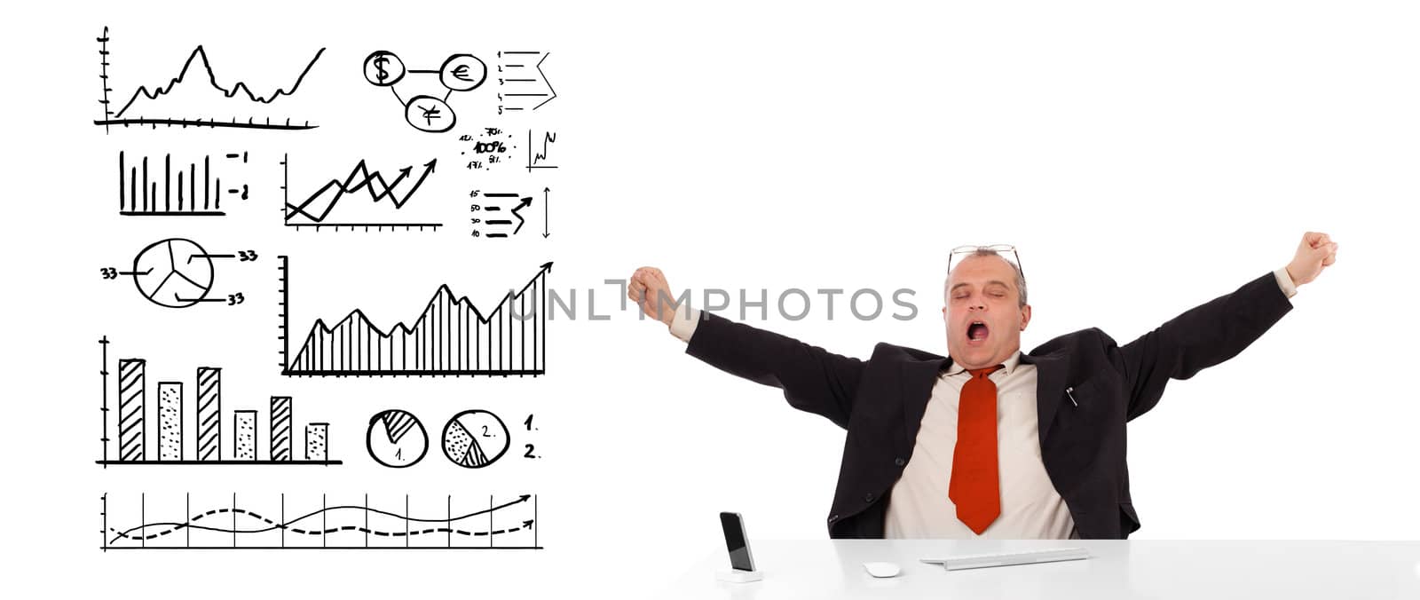 Businessman sitting at desk with diagrams and graphs, isolated on white