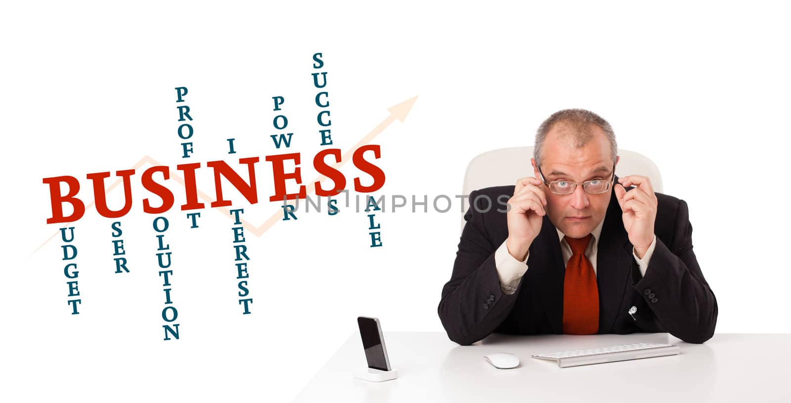 businesman sitting at desk with business word cloud, isolated on white