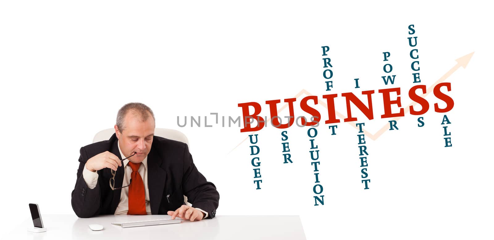 businesman sitting at desk with business word cloud, isolated on white