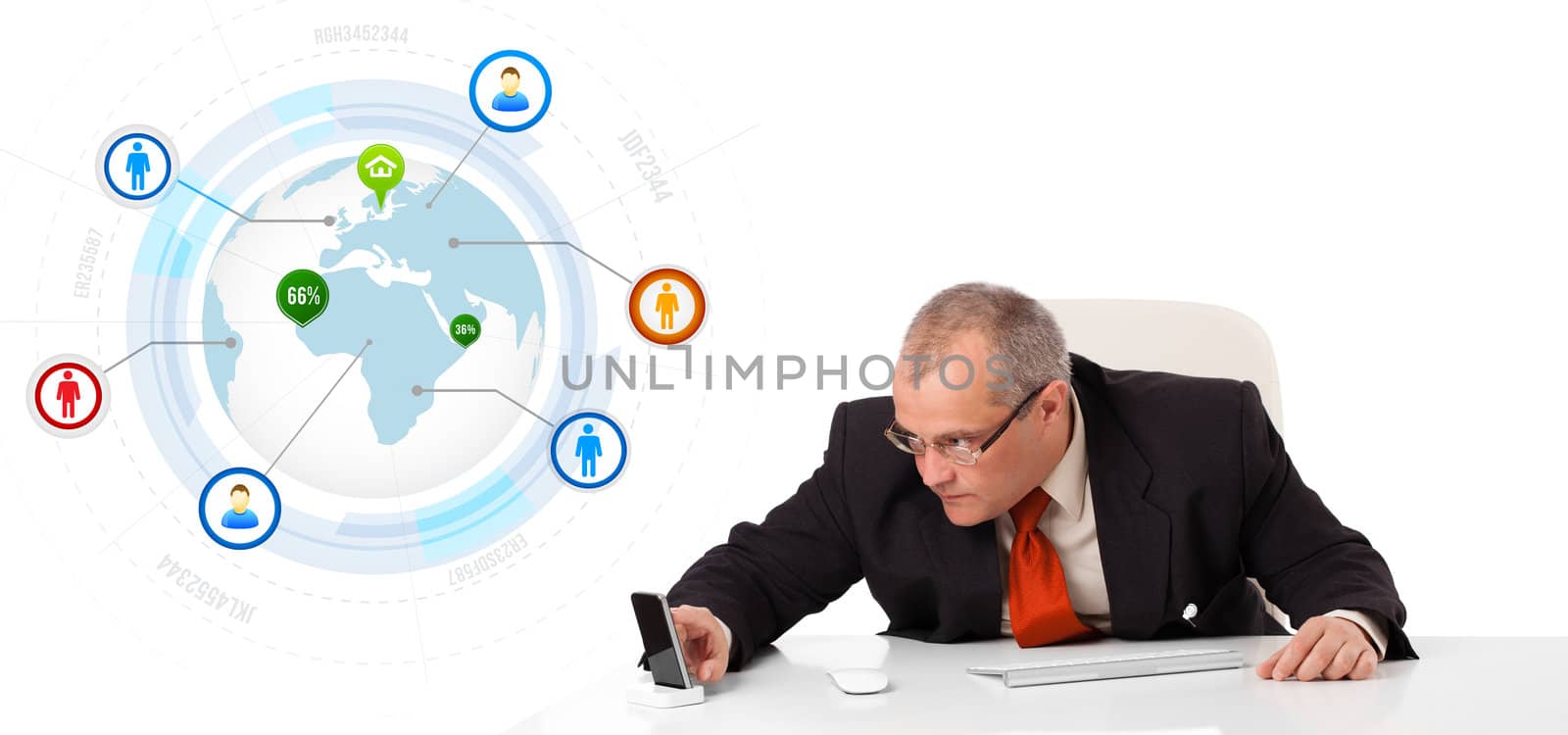 businessman sitting at desk and holding a mobilephone with globe and social icons, isolated on white