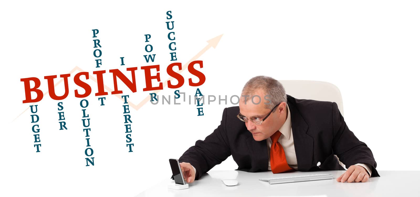 businesman sitting at desk with business word cloud, isolated on white