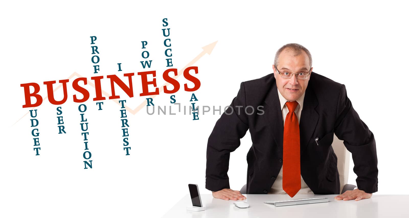 businesman sitting at desk with business word cloud, isolated on white