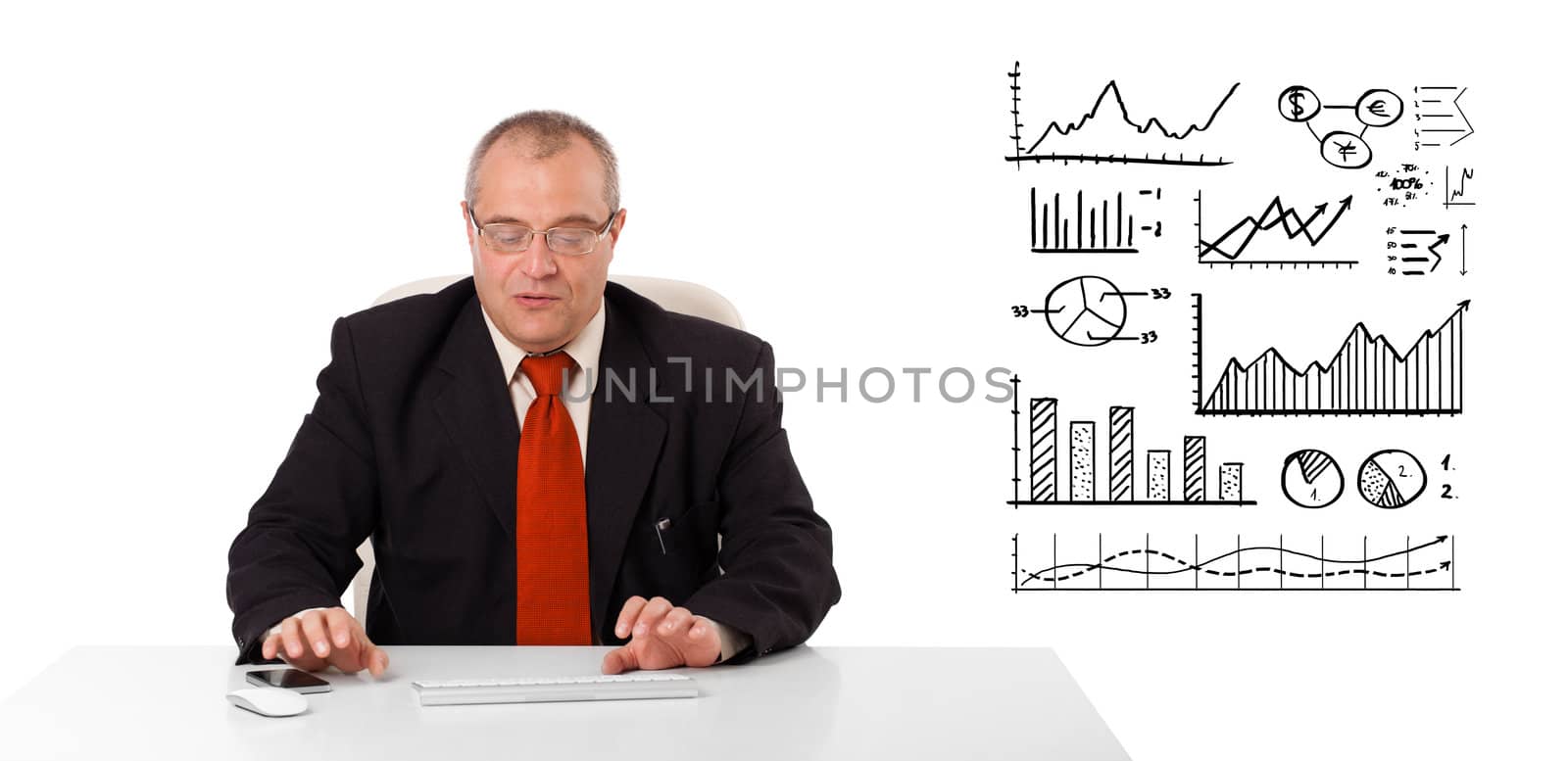 Businessman sitting at desk with diagrams and graphs, isolated on white