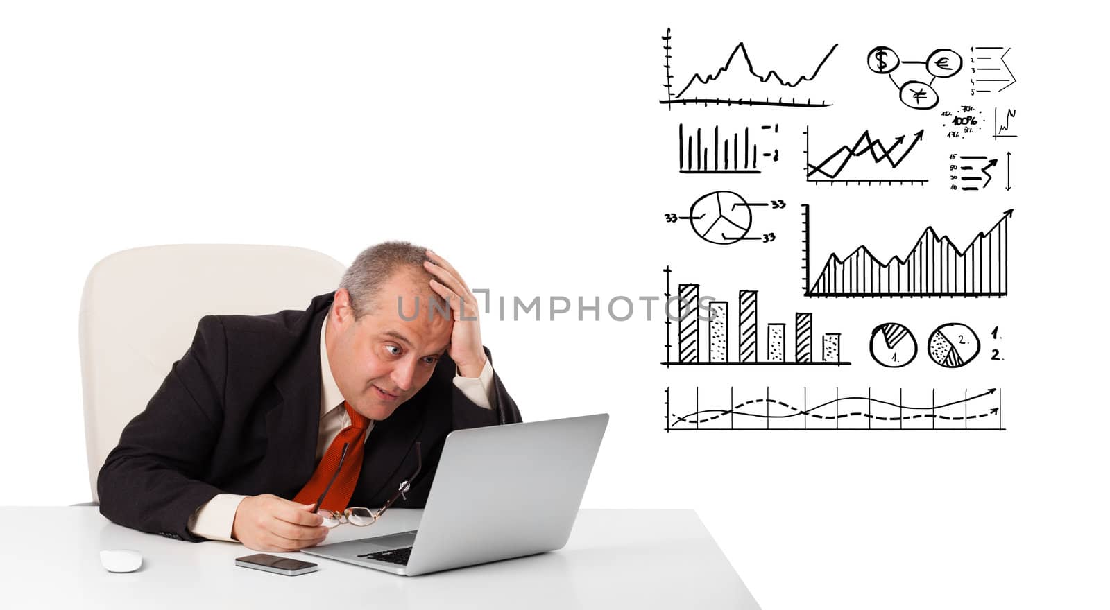 Businessman sitting at desk with diagrams and laptop, isolated on white