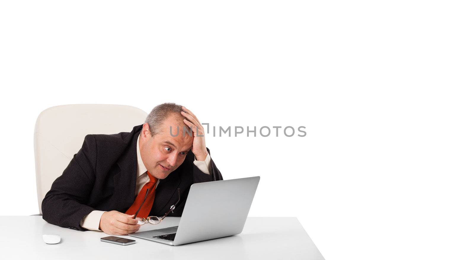 buisnessman sitting at desk and looking laptop with copy space, isolated on white