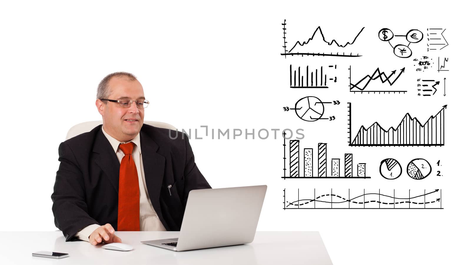 Businessman sitting at desk with diagrams and laptop, isolated on white