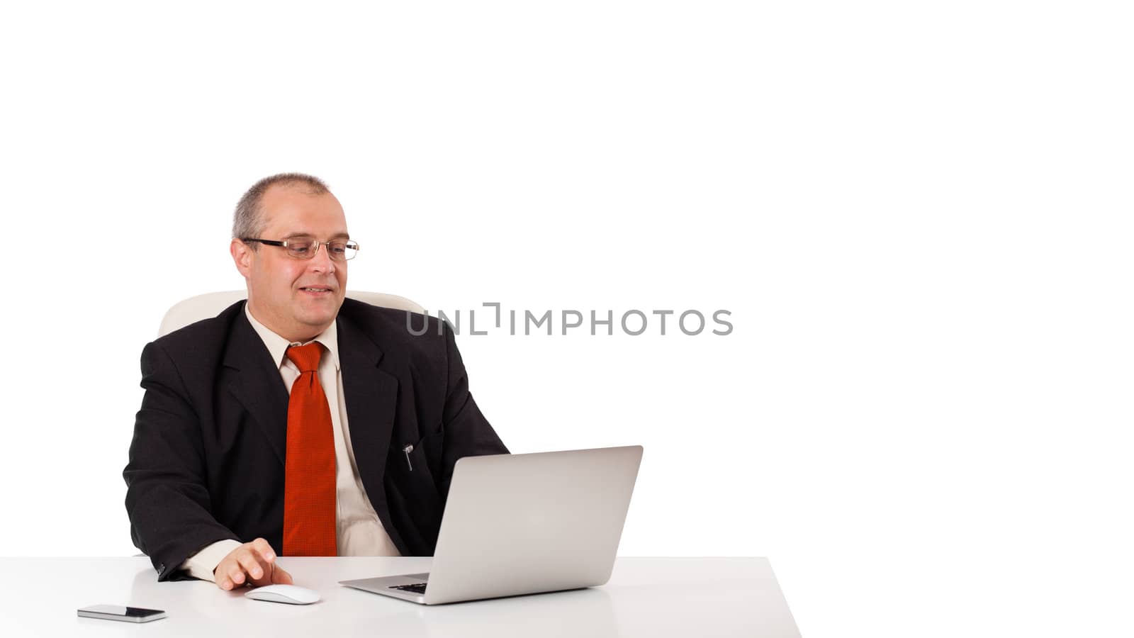 buisnessman sitting at desk and looking laptop with copy space, isolated on white