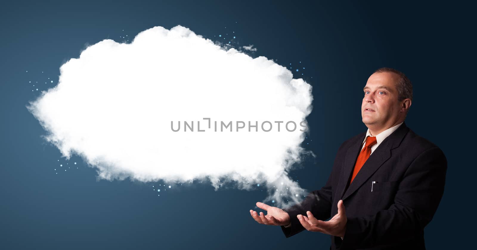 businessman in suit presenting abstract cloud copy space