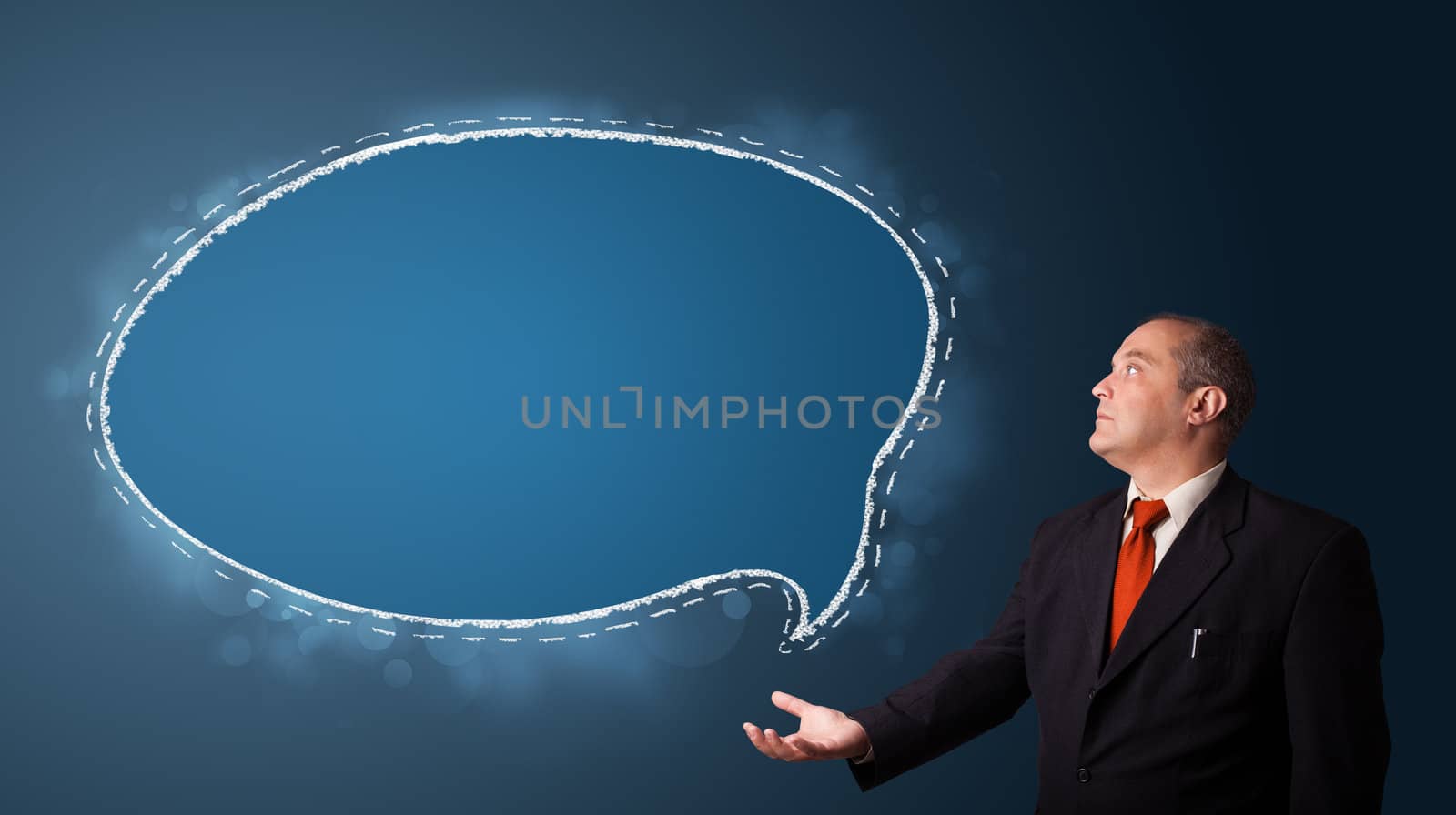 businessman in suit presenting speech bubble copy space