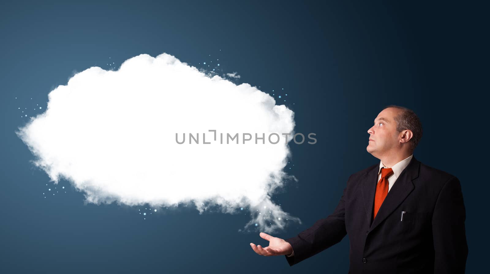 businessman in suit presenting abstract cloud copy space