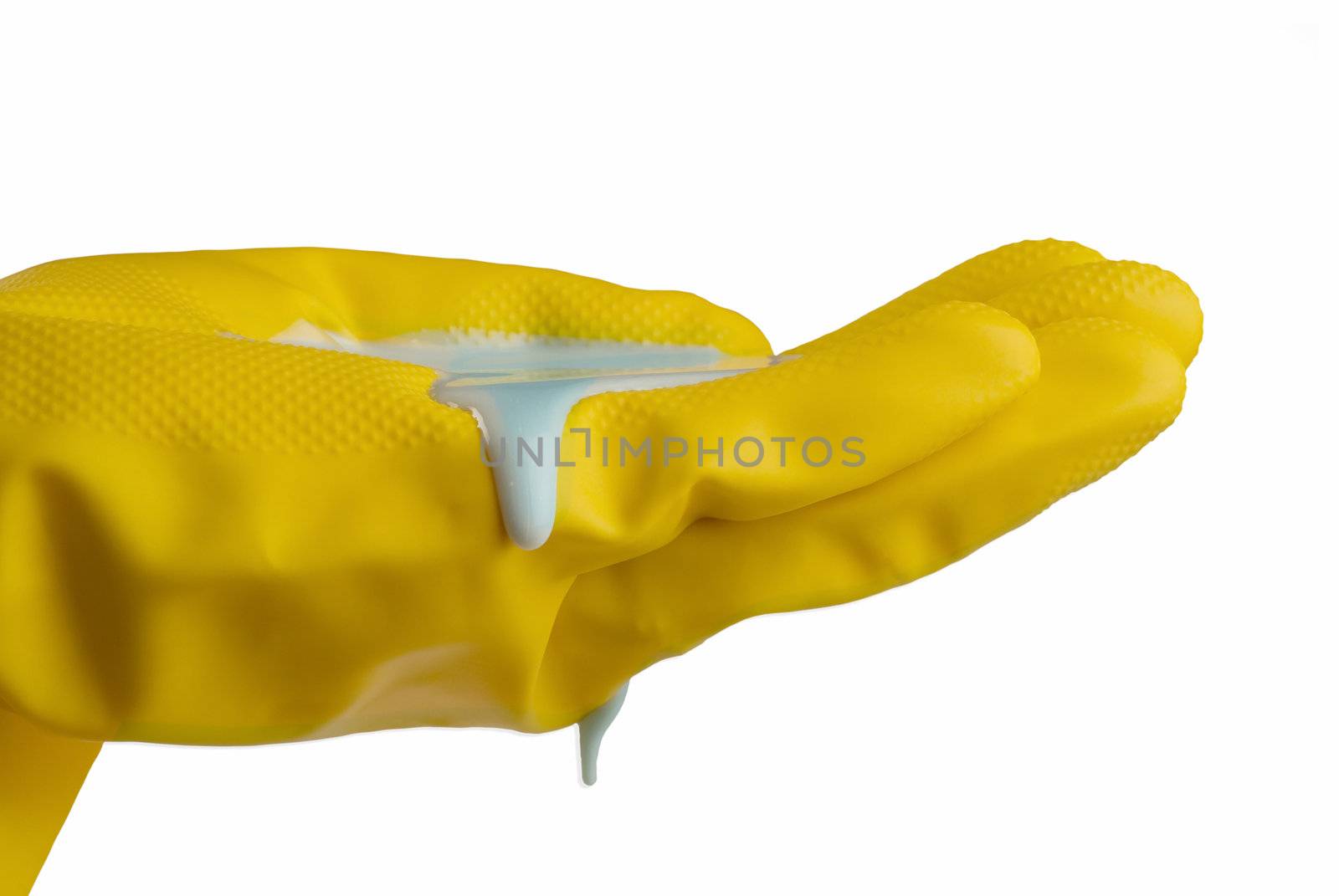 Yellow rubber gloves with liquid soap in hand