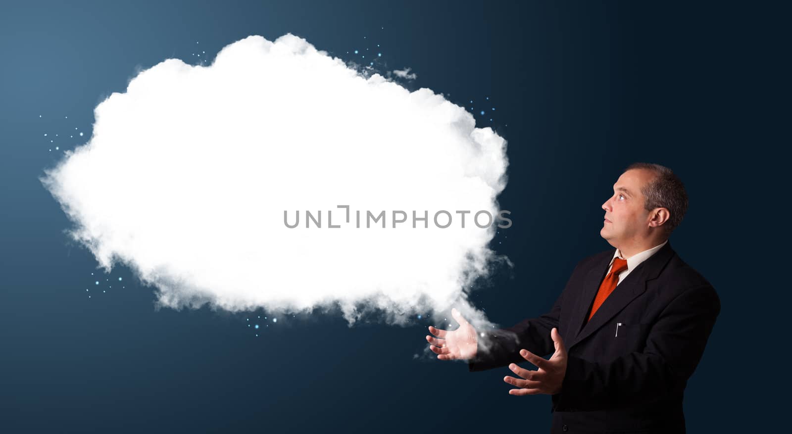 businessman in suit presenting abstract cloud copy space