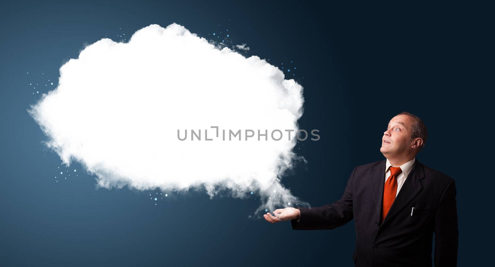 businessman in suit presenting abstract cloud copy space