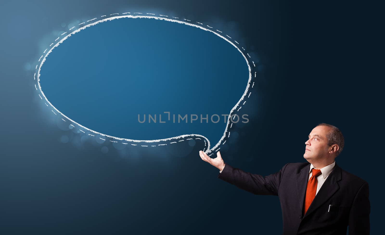 businessman in suit presenting speech bubble copy space