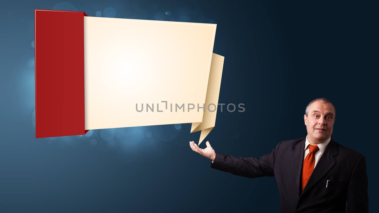 businessman in suit presenting modern origami copy space