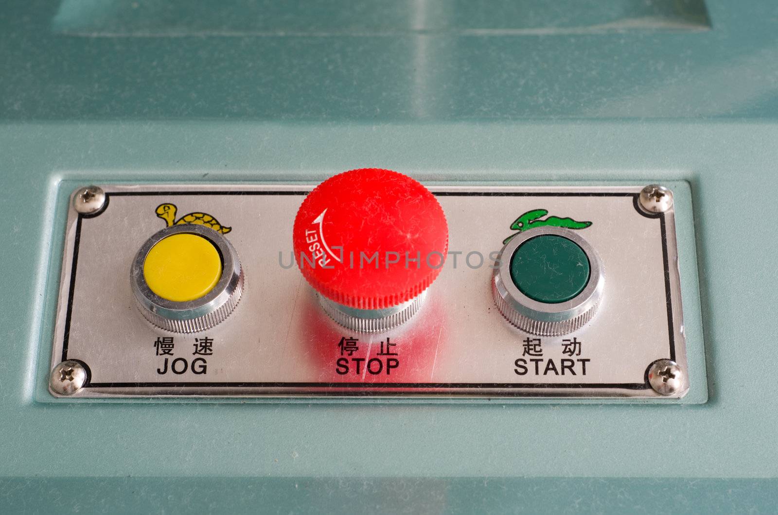 Industrial machine start stop and jog buttons in english and chinese letters
