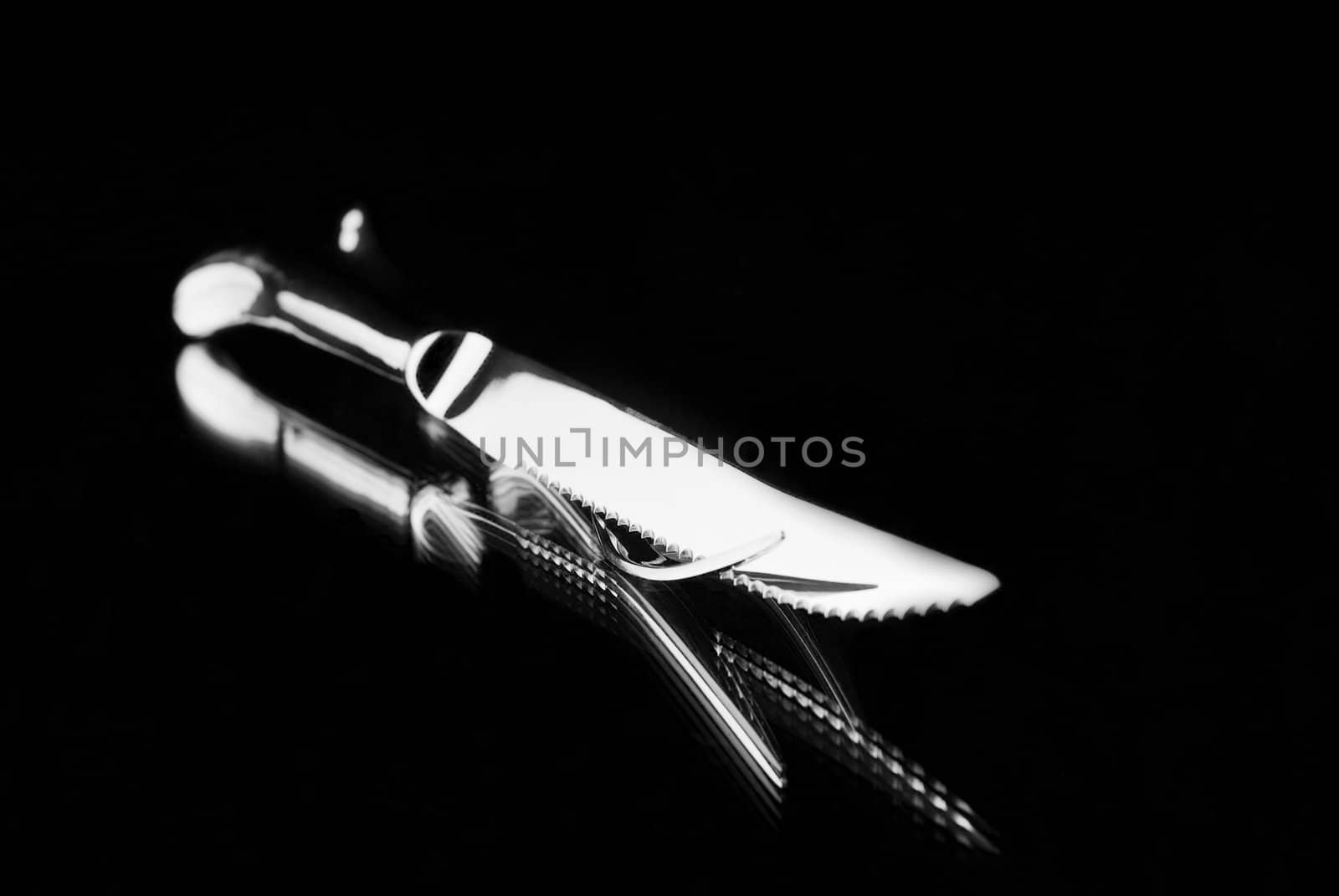 Carving Set on mirror with black background by alistaircotton