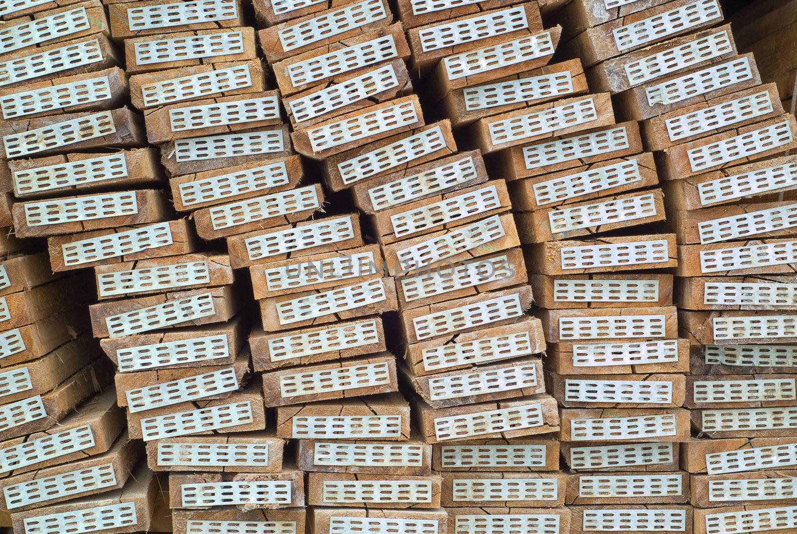 Stacked wood or contruction timber in factory warehouse