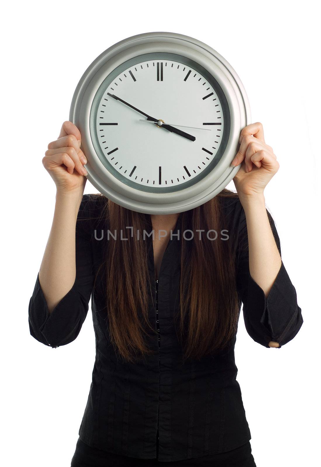 Business woman holding clock over face isolated on white - vertical