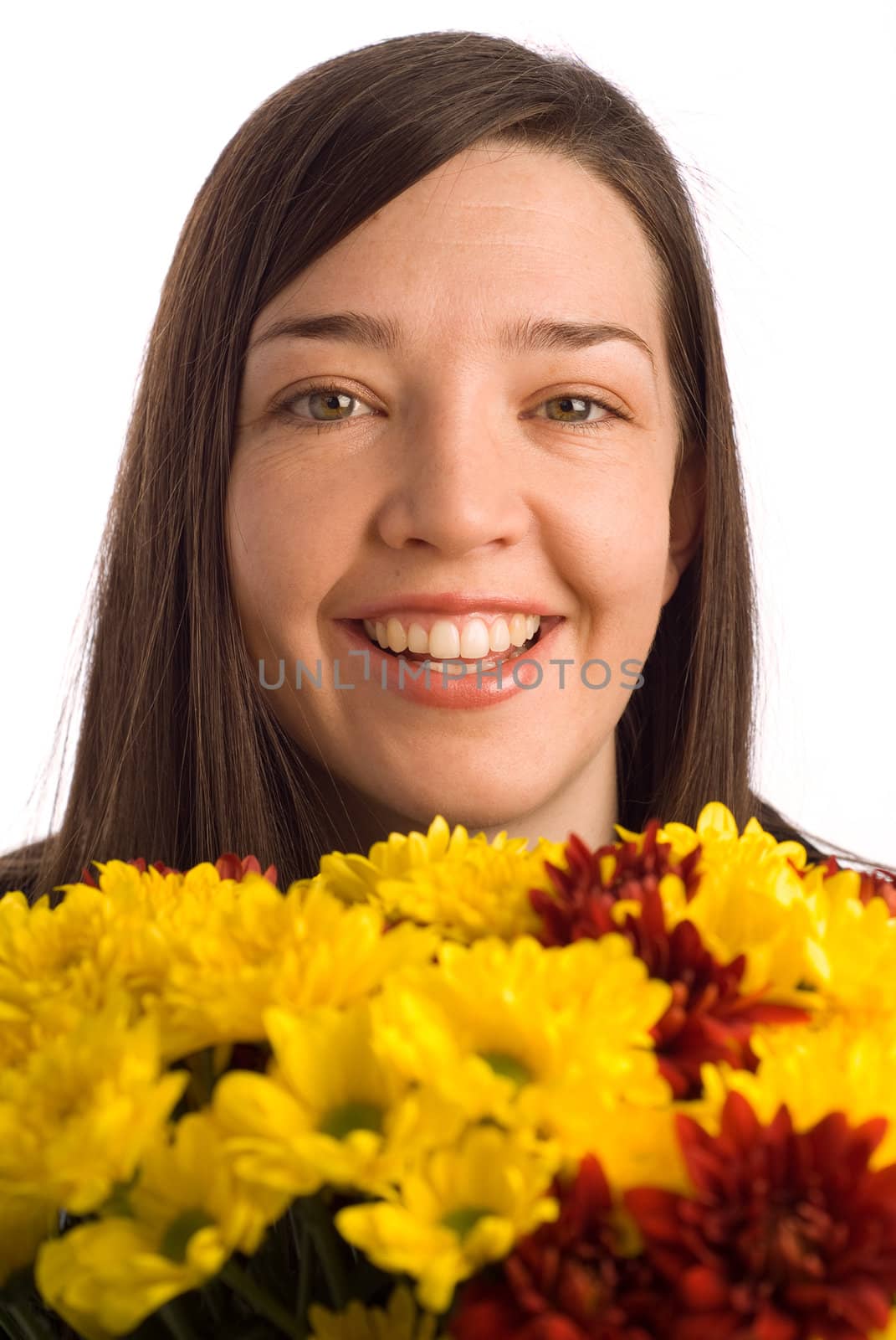 Smiling happy secretary, assistant or student woman smelling valentine or gift flowers isolated on white and looking at camera