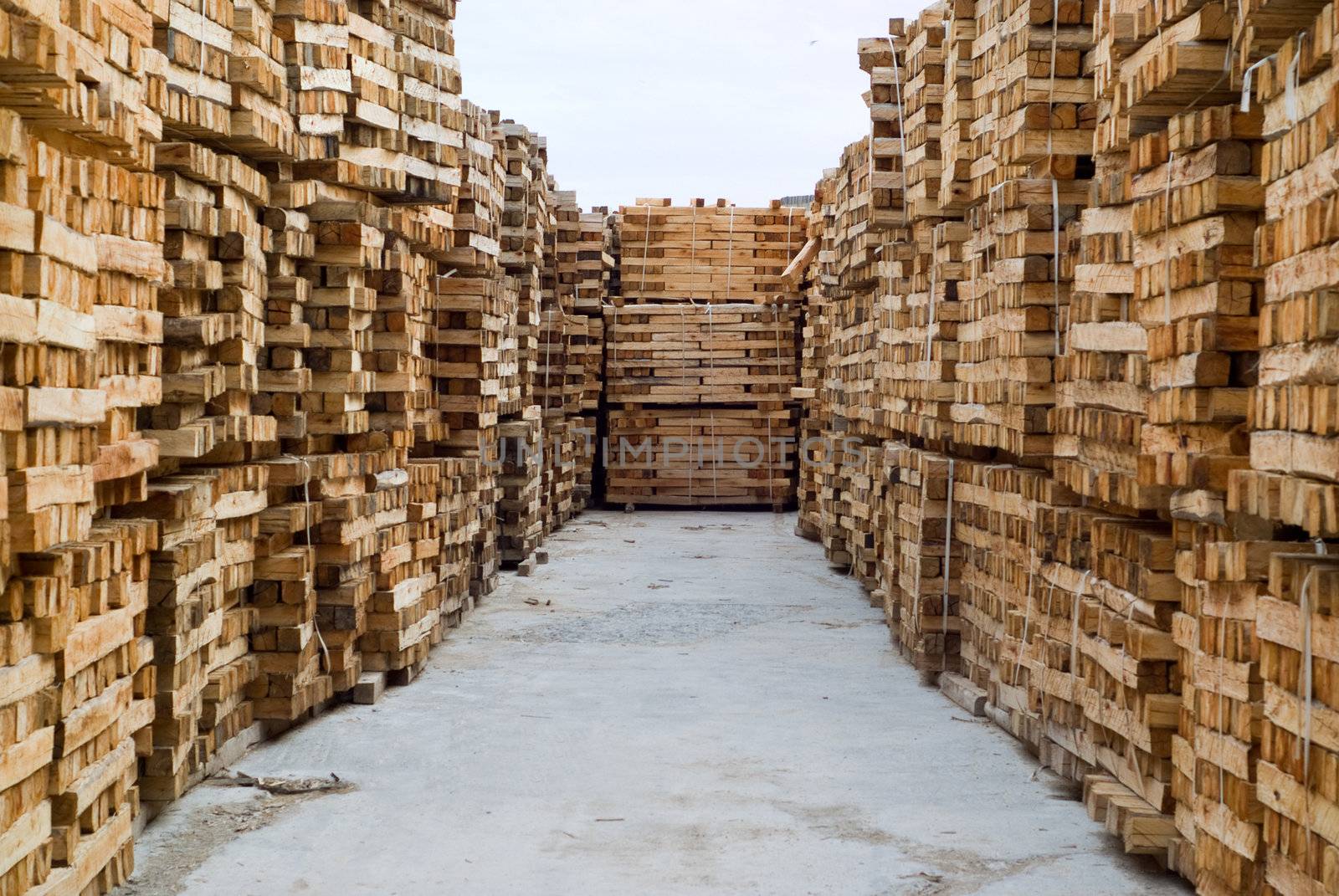 Stacked wood or timber in factory warehouse or storage area