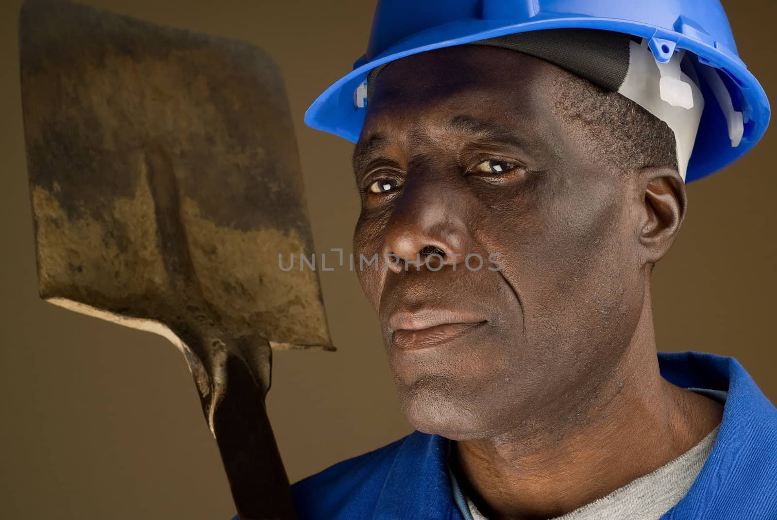 Construction Worker Resting Shovel on Shoulder by alistaircotton