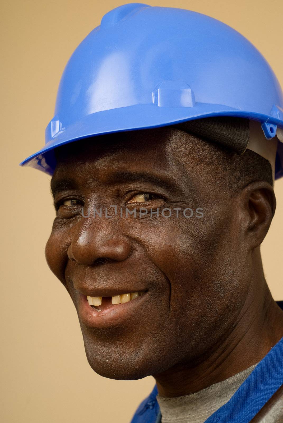 Close up of happy african construction worker, plumber, electrician, handyman