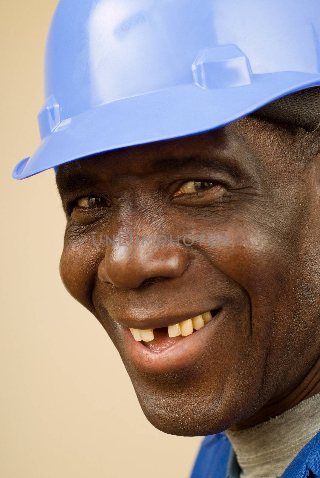 Close up of happy african construction worker, plumber, electrician, handyman