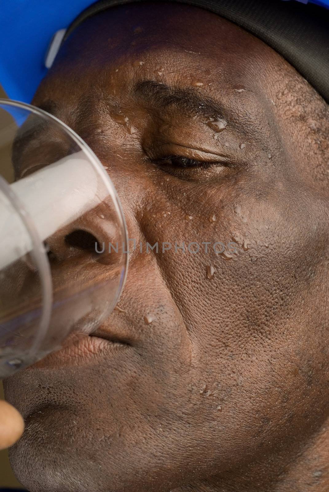 Tired Construction Worker Drinking Water