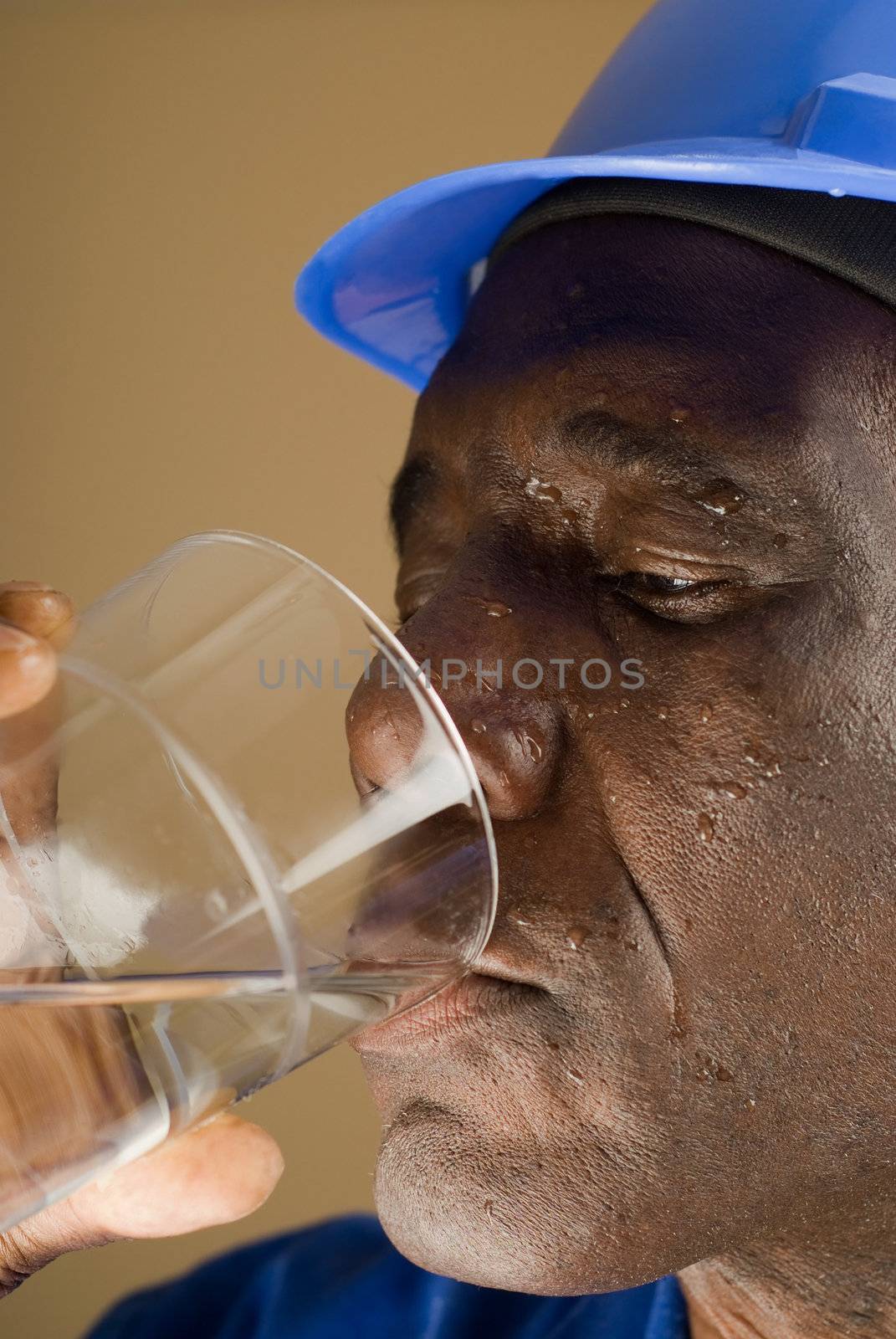 Tired Construction Worker Drinking Water