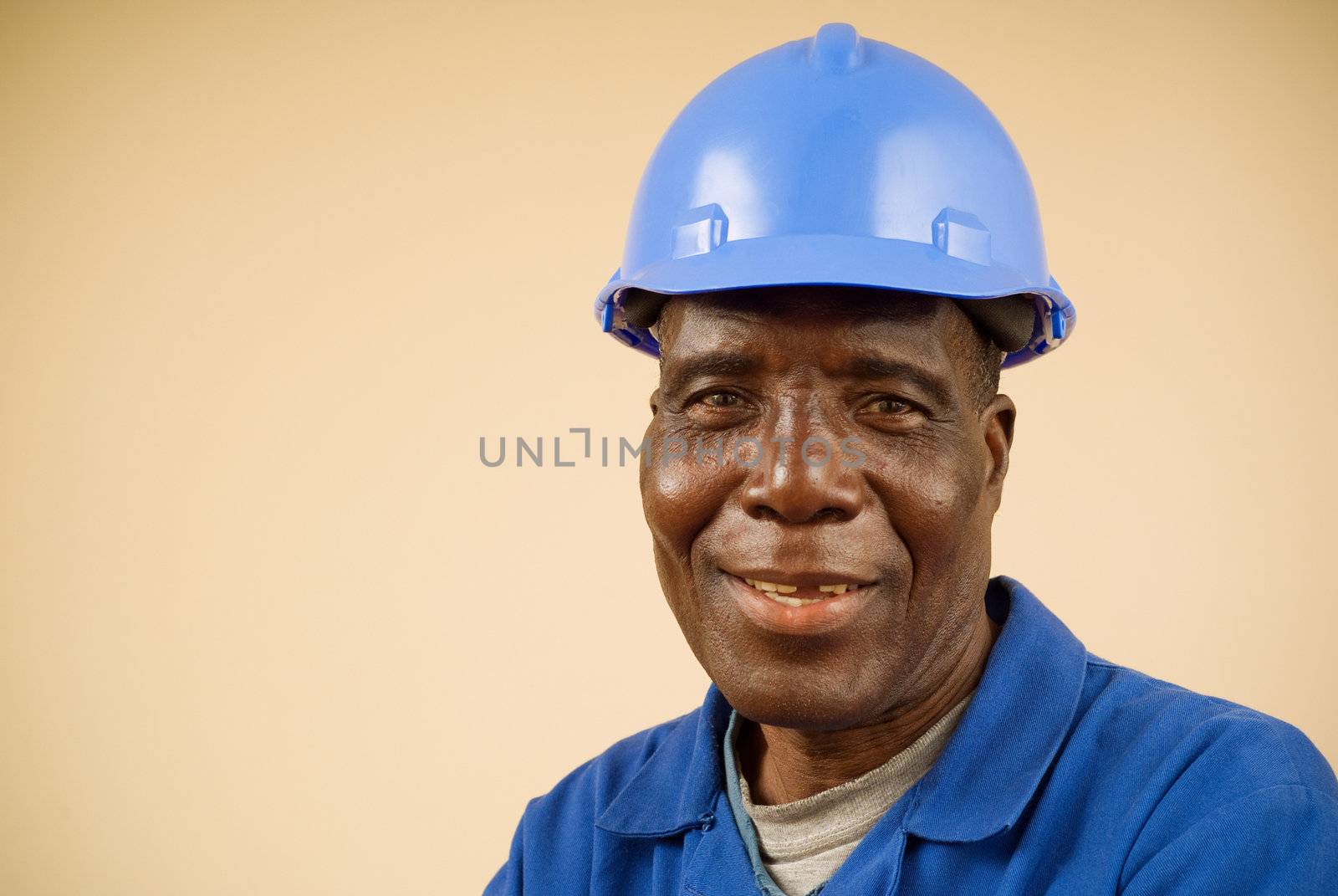 Close up of happy african construction worker, plumber, electrician, handyman