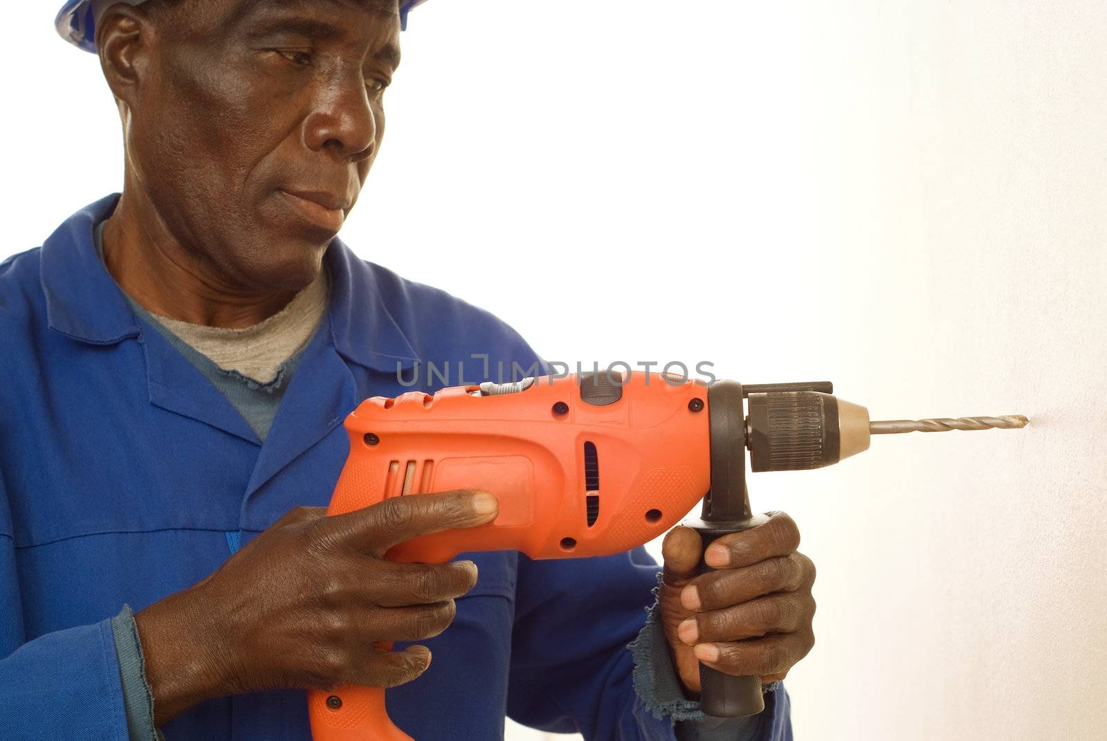 African American Construction Worker, Handyman, Carpenter, Drilling with Electrical Power Tool