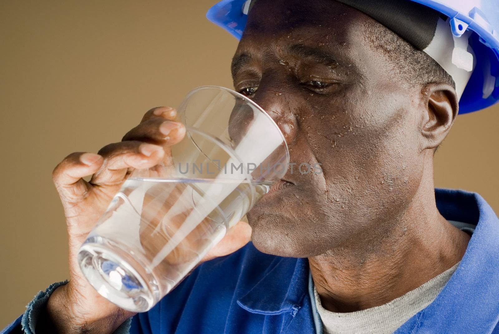 Tired Construction Worker Drinking Water